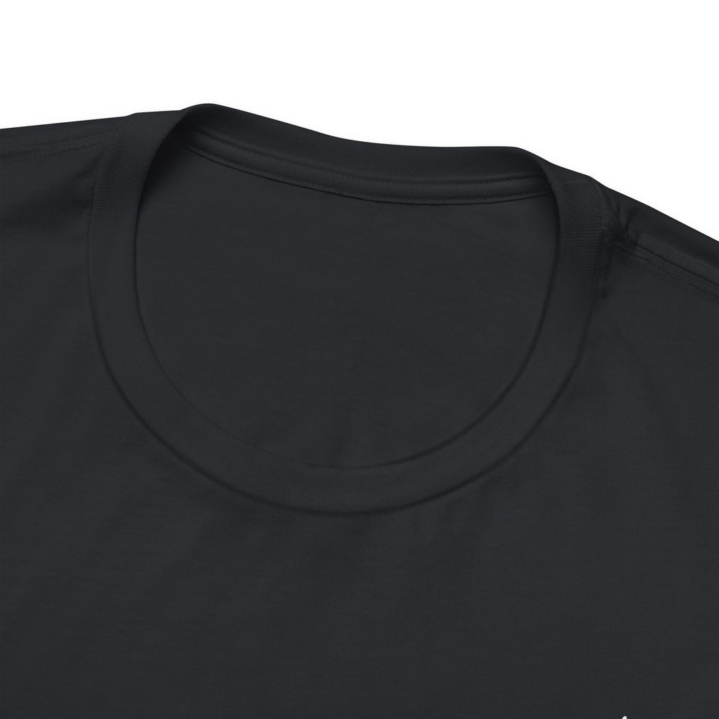 Close-up of a black t-shirt with a plain background